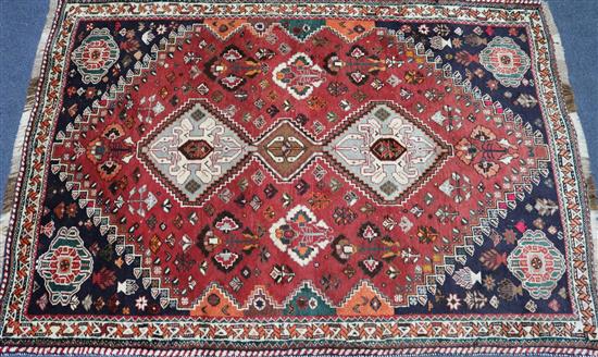 A Persian red ground rug, 178 x 124cm